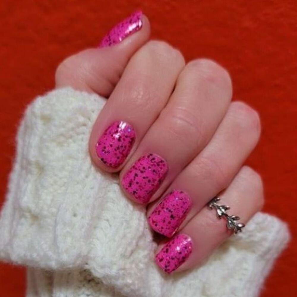 Color Street, Exes and Oh’s, fuchsia shade with pink, red, silver sparkles